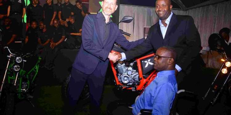 L- R Huib van de Grisjparde- KIBO CEO, Alvin Mageto, Director Operation KIBO and Gideon Apiyo Oele-Deputy Director Min of Industry, Trade and Cooperatives during the launch of the KIBO K160E- Evolution. The bike is engineered to provide maximum comfort and power while navigating city traffic, remaining fuel efficient and environmentally friendly.