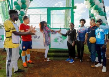 Lornah Kiplagat- World Champion, Olympian and Tatu City Health & Wellness Ambassador and Linda Nyaseda-Head of City Management & DCC Tatu City, flanked by Tatu City staff football team and Unity Homes FC, officially open Sports @ Tatu, a recreational hub for wellness and fitness at Tatu City.