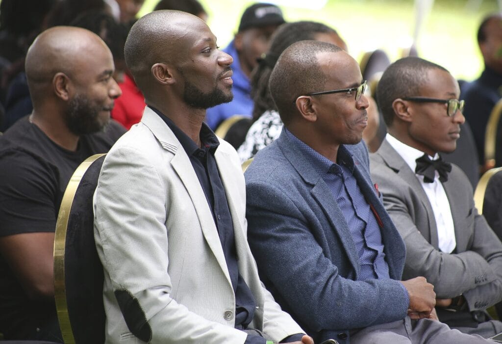 Mi Vida Homes CEO Sam Kariuki (middle) and other guests follow proceedings during KEZA investor forum