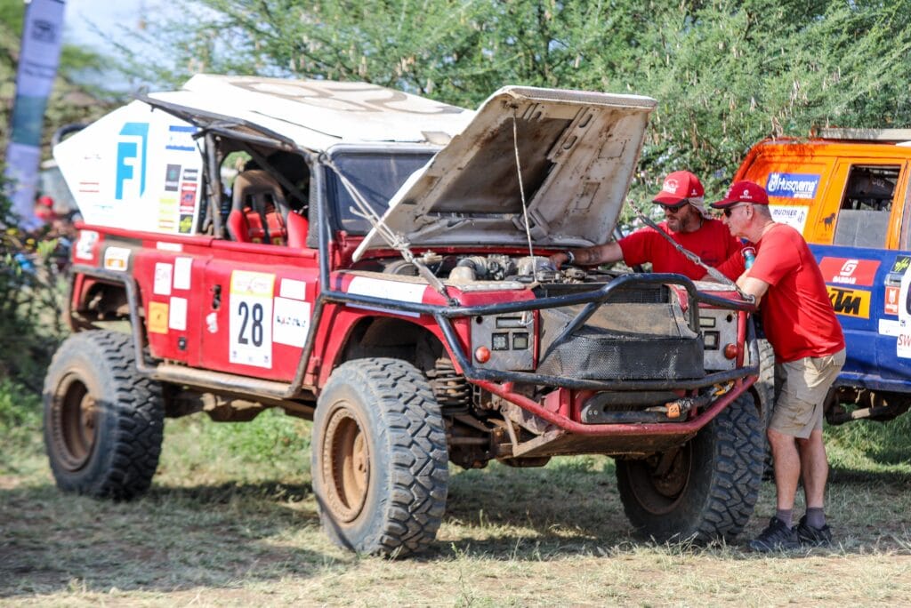 The Car No. 28 team checking their car during the scrutineering process of the 2024 Rhino Charge challenge at Torosei in Kajiado County