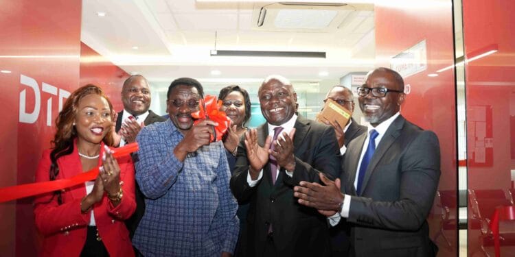 H.E James Orengo, Governor of Siaya County, leads the Diamond Trust Bank (DTB) executive team in the ribbon-cutting ceremony for the official launch of the DTB Bondo branch in Bondo, Siaya County. The DTB team was represented by George Otiende, Director of Retail Banking; Dr. Kennedy Nyakomitta, Director of Commercial Banking and Lillian Ngala, Director of Human Resources.