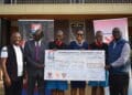 he Griffin Memorial Endowment Trust (GMET) Trustees led by Chairman Noah Meely (Right) Treasurer David Wachira (far left) and Secretary Vivian Onano present a cheque for KES 15M to Starehe Boys' Centre that was received by the Director Mr. Fred Okono (second left)