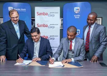 Dinesh Kotecha, CEO of Simba Corp (second from the left), and Renato D'souza, Head of Commercial Banking for Business & Commercial Clients at Stanbic Bank Kenya (second from the right) during the signing of an MoU on Thursday, 12th in Nairobi.