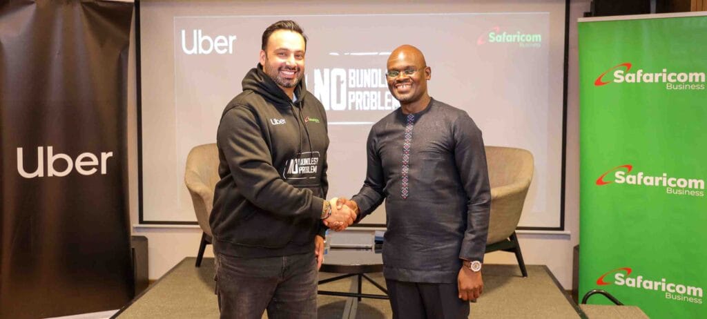 Imran Manji- Head of East and South Africa Uber (Left) and Bernard Muteti -Enterprise Solutions Director Safaricom (Right) shaking hands during the partnership announcement between Safaricom and Uber to provide free data for drivers and riders in Kenya