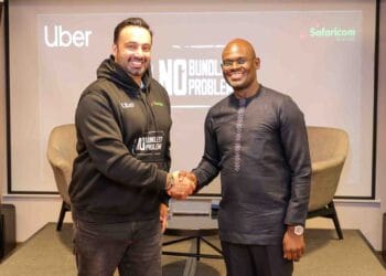 Imran Manji- Head of East and South Africa Uber (Left) and Bernard Muteti -Enterprise Solutions Director Safaricom (Right) shaking hands during the partnership announcement between Safaricom and Uber to provide free data for drivers and riders in Kenya