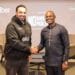 Imran Manji- Head of East and South Africa Uber (Left) and Bernard Muteti -Enterprise Solutions Director Safaricom (Right) shaking hands during the partnership announcement between Safaricom and Uber to provide free data for drivers and riders in Kenya