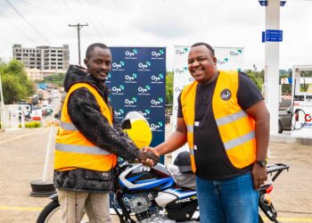 L-R: Maisha Nikujituma Campaign winner Stephen Kimakon receives his motorcycle from Oye Co-Founder and CEO Kevin Mutiso.