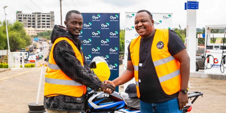 L-R: Maisha Nikujituma Campaign winner Stephen Kimakon receives his motorcycle from Oye Co-Founder and CEO Kevin Mutiso.