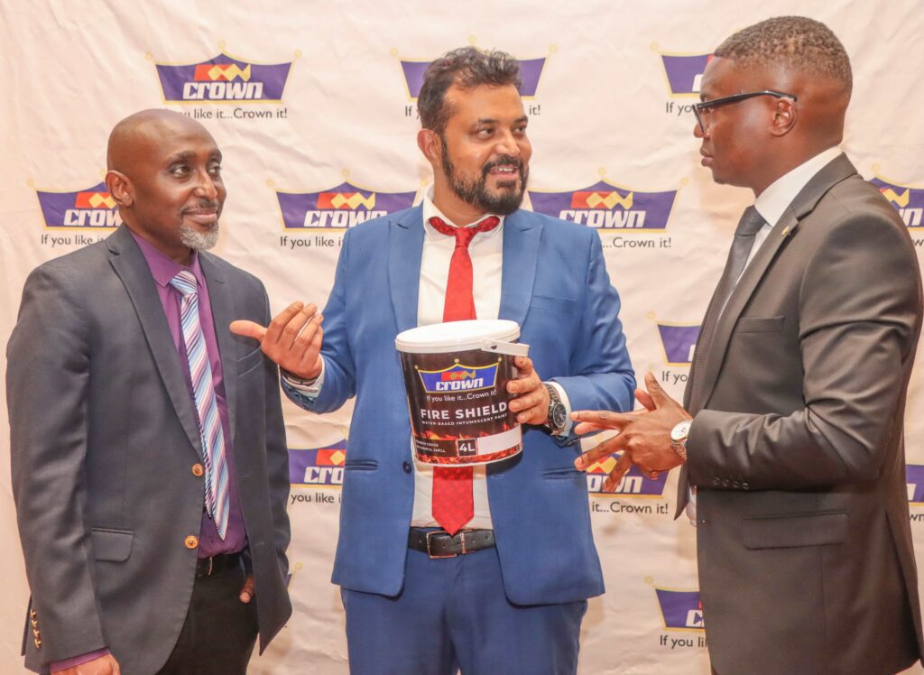 From left Kelvin Munyi, Group marketing manager, Crown Paints Plc, Group product manager Rakesh Biswas and Tom Oyier, head of constructions sector, pose for a photo with the newly launched products that will enhance flooring and fire protection. The new innovations are designed to deliver the next-generation solutions combining durability and safety for customers.