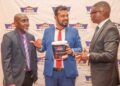 From left Kelvin Munyi, Group marketing manager, Crown Paints Plc, Group product manager Rakesh Biswas and Tom Oyier, head of constructions sector, pose for a photo with the newly launched products that will enhance flooring and fire protection. The new innovations are designed to deliver the next-generation solutions combining durability and safety for customers.