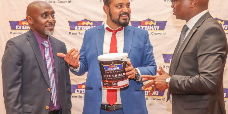 From left Kelvin Munyi, Group marketing manager, Crown Paints Plc, Group product manager Rakesh Biswas and Tom Oyier, head of constructions sector, pose for a photo with the newly launched products that will enhance flooring and fire protection. The new innovations are designed to deliver the next-generation solutions combining durability and safety for customers.