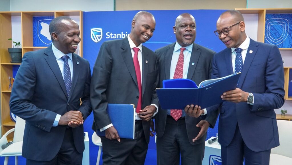 Stanbic Bank Executives pose for a photo during the release of the half year results