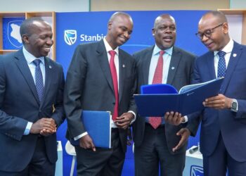 Stanbic Bank Executives pose for a photo during the release of the half year results