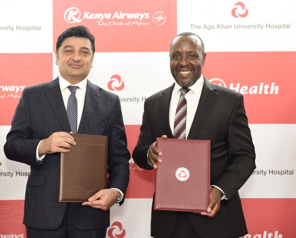 Aga Khan University Hospital CEO Rashid Khalani & Kenya Airways CEO Allan Kilavuka during the signing of a medical tourism partnership aimed at enhancing medical travel for patients across Africa