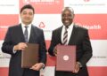 Aga Khan University Hospital CEO Rashid Khalani & Kenya Airways CEO Allan Kilavuka during the signing of a medical tourism partnership aimed at enhancing medical travel for patients across Africa
