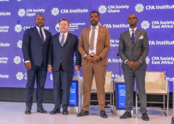 From Left, Oyebanji Fehintola, Executive Board Member & Head, Financial Services, Africa Finance Corporation - United States; Marshall Bailey - Chairman, Board of Governors, CFA Institute; Abubakar Hassan Abubakar - The Principal Secretary, State Department for Investment Promotion, Ministry of Investment, Trade and Industry and Francis Nasyomba, CFA Society East Africa, President during the official opening of the Africa Investment Conference In Nairobi.