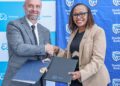 Stanbic Bank Regional Head, East Africa, Business and Commercial Banking, Florence Wanja and Salvador Caetano, Kenya Limited Managing Director, Aurelien Glay, during the signing of the Memorandum of Understanding between the two companies.