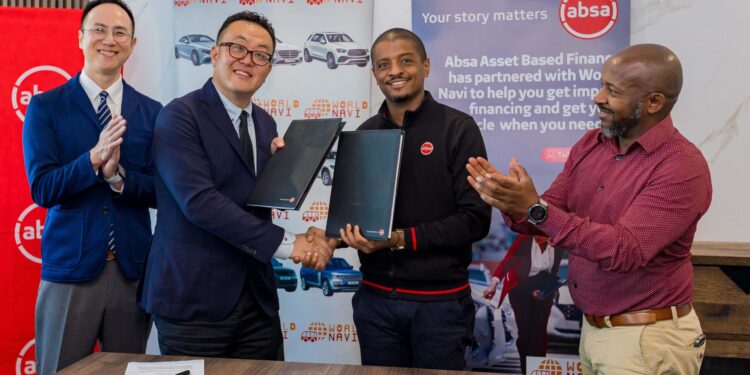 Absa Bank Kenya Business Banking Director Renato D'souza (2nd Right) and World Navi CEO Yoshifumi Sawada (2nd Left) during the signing of a strategic Asset Based Financing partnership with World Navi, enabling customers to directly import vehicles from Japan while accessing structured asset financing from Absa Bank. Looking on is World Navi East Africa General Manager Yusuke Tamano (Left) and Absa Bank Kenya Head of Asset Finance Edwin Miano.