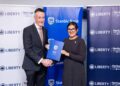 Kieran Godden, Group CEO, Liberty Kenya Holdings Plc, and Anjali Harkoo, Head of Insurance and Asset Management at Stanbic Bank Kenya, during the signing of a Vehicle and Asset Financing partnership between Stanbic Bank and Liberty Kenya.