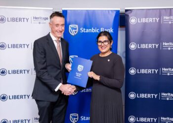 Kieran Godden, Group CEO, Liberty Kenya Holdings Plc, and Anjali Harkoo, Head of Insurance and Asset Management at Stanbic Bank Kenya, during the signing of a Vehicle and Asset Financing partnership between Stanbic Bank and Liberty Kenya.