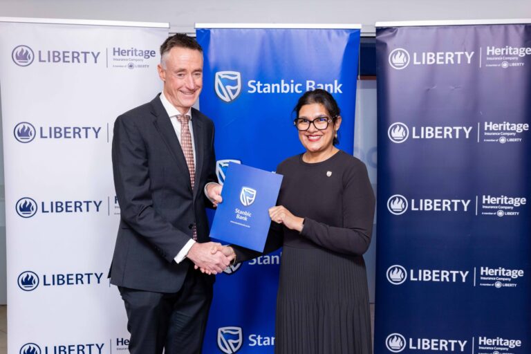 Kieran Godden, Group CEO, Liberty Kenya Holdings Plc, and Anjali Harkoo, Head of Insurance and Asset Management at Stanbic Bank Kenya, during the signing of a Vehicle and Asset Financing partnership between Stanbic Bank and Liberty Kenya.