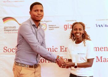 I&M Foundation, Programs Lead, Naomi Cheres awarding the overall winner of the Predators Den, Carl Naurori