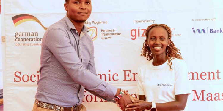 I&M Foundation, Programs Lead, Naomi Cheres awarding the overall winner of the Predators Den, Carl Naurori