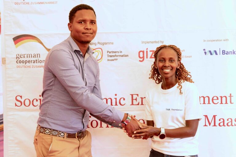 I&M Foundation, Programs Lead, Naomi Cheres awarding the overall winner of the Predators Den, Carl Naurori