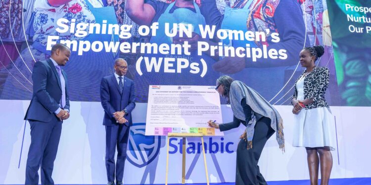 UN Women Country Representative to Kenya, Ms. Antonia N'gabala Sodonon (Second Right) signing the seven UN Women's Empowerment Principles (WEPs). Looking on is Regional Chief Executive, East Africa, Standard Bank, Dr. Joshua Oigara (Second Left), Acting Chief Executive, Stanbic Bank Kenya & South Sudan (Far Left) and Participant Engagement Manager, Global Compact Network Kenya, Mary Waweru (Far Right)