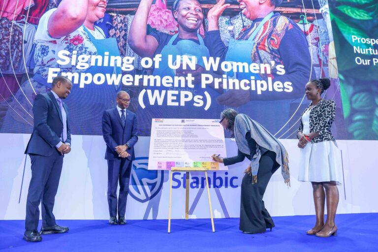 UN Women Country Representative to Kenya, Ms. Antonia N'gabala Sodonon (Second Right) signing the seven UN Women's Empowerment Principles (WEPs). Looking on is Regional Chief Executive, East Africa, Standard Bank, Dr. Joshua Oigara (Second Left), Acting Chief Executive, Stanbic Bank Kenya & South Sudan (Far Left) and Participant Engagement Manager, Global Compact Network Kenya, Mary Waweru (Far Right)