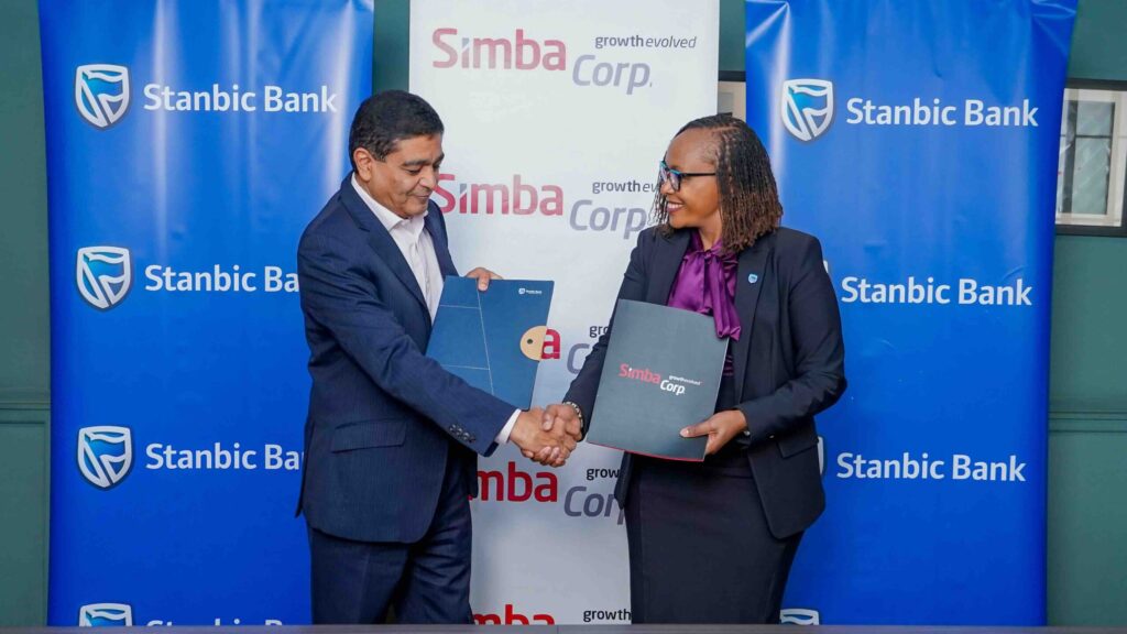Stanbic bank Kenya’s Regional Executive Head Business & Commercial banking, Florence Wanja signs and exchanging signed documents with Simba Corporation Group CEO, Dinesh Kotecha, during the signing of a Memorandum of Understanding (MOU) at their head office in Nairobi. Simba Corp owns and operates Associated Vehicle Assemblers Limited, one of East Africa’s largest vehicle assembly plants. AVA assembles trucks, pickups, buses, and passenger vehicles for several global brands.