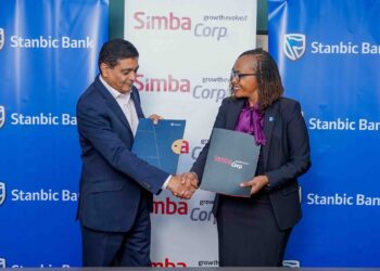 Stanbic bank Kenya’s Regional Executive Head Business & Commercial banking, Florence Wanja signs and exchanging signed documents with Simba Corporation Group CEO, Dinesh Kotecha, during the signing of a Memorandum of Understanding (MOU) at their head office in Nairobi. Simba Corp owns and operates Associated Vehicle Assemblers Limited, one of East Africa’s largest vehicle assembly plants. AVA assembles trucks, pickups, buses, and passenger vehicles for several global brands.