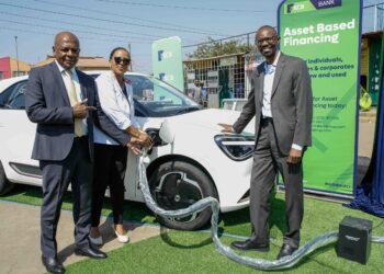 Matatu Owners Association President Albert Karagacha, KCB Unit Head, Asset Finance and Insurance, Juliana Kinyua, and ePureMotion CEO Gilbert Saggia demonstrate the EV charging system during the official launch of an EV charging site for Matatu Owners Association vehicles in Buruburu, Nairobi, on July 14, 2026.