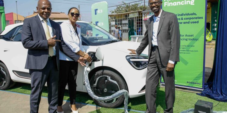 Matatu Owners Association President Albert Karagacha, KCB Unit Head, Asset Finance and Insurance, Juliana Kinyua, and ePureMotion CEO Gilbert Saggia demonstrate the EV charging system during the official launch of an EV charging site for Matatu Owners Association vehicles in Buruburu, Nairobi, on July 14, 2026.