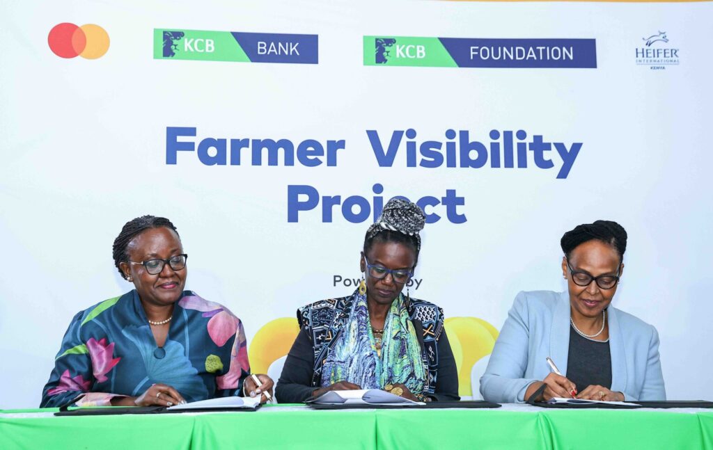 KCB Foundation Managing Director Mendi Njonjo (C), Country Director Heifer International Kenya, Wairimu Munyinyi (L) and KCB SME Banking and Agribusiness Head Naomi Ndele sign MoUs during the Farmer Visibility Project launch at Kencom today.