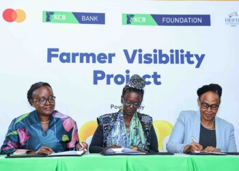 KCB Foundation Managing Director Mendi Njonjo (C), Country Director Heifer International Kenya, Wairimu Munyinyi (L) and KCB SME Banking and Agribusiness Head Naomi Ndele sign MoUs during the Farmer Visibility Project launch at Kencom today.