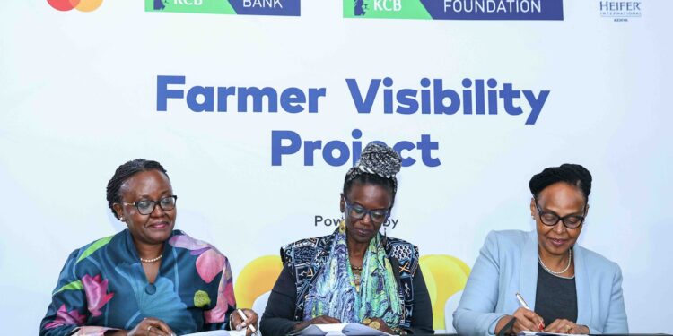 KCB Foundation Managing Director Mendi Njonjo (C), Country Director Heifer International Kenya, Wairimu Munyinyi (L) and KCB SME Banking and Agribusiness Head Naomi Ndele sign MoUs during the Farmer Visibility Project launch at Kencom today.