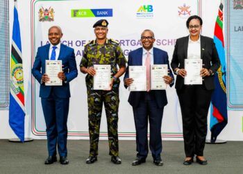 Defence PS Dr Patrick Mariru, Chief of the Defence Forces General Charles Kahariri, Housing PS Charles Hinga, and KCB Bank Kenya MD Annastacia Kimtai display the signed MOU allowing KDF officers to buy units under the Affordable Housing Programme under the Civil servants' mortgage scheme at 4% interest.