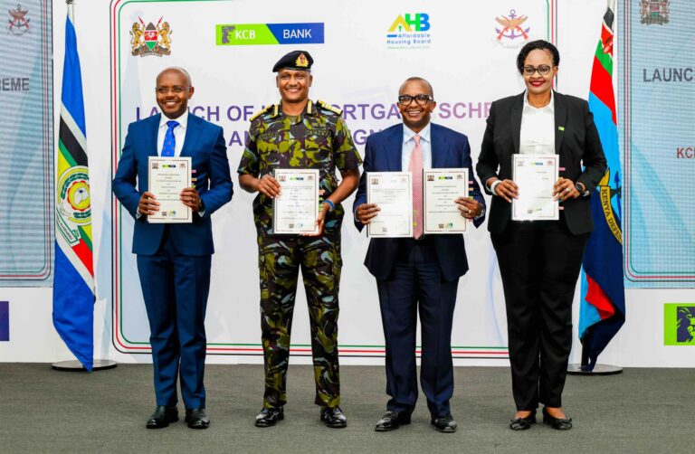 Defence PS Dr Patrick Mariru, Chief of the Defence Forces General Charles Kahariri, Housing PS Charles Hinga, and KCB Bank Kenya MD Annastacia Kimtai display the signed MOU allowing KDF officers to buy units under the Affordable Housing Programme under the Civil servants' mortgage scheme at 4% interest.