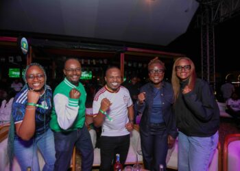 Sheila Changangu, Marketing Director, Visa East Africa, and Andrew Kabeke, CEO, Safaricom Money Transfer Services Limited, reward M-Pesa GlobalPay Virtual Visa card customers Ashley Kibara and Mayaka Hassan at the Semi-Final Watch Party.