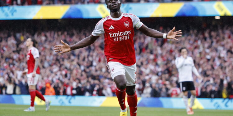 epa12928466 Bukayo Saka of Arsenal celebrates scoring the 2-0 goal during the English Premier League match Arsenal FC against Fulham FC, in London, Britain, 02 May 2026. EPA/TOLGA AKMEN EDITORIAL USE ONLY. No use with unauthorized audio, video, data, fixture lists, club/league logos, 'live' services or NFTs. Online in-match use limited to 120 images, no video emulation. No use in betting, games or single club/league/player publications.