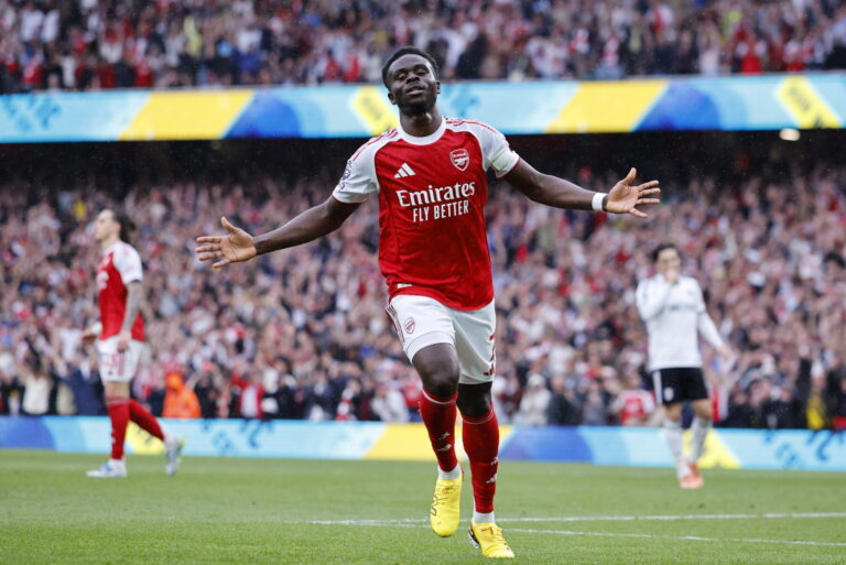 epa12928466 Bukayo Saka of Arsenal celebrates scoring the 2-0 goal during the English Premier League match Arsenal FC against Fulham FC, in London, Britain, 02 May 2026.  EPA/TOLGA AKMEN EDITORIAL USE ONLY. No use with unauthorized audio, video, data, fixture lists, club/league logos, 'live' services or NFTs. Online in-match use limited to 120 images, no video emulation. No use in betting, games or single club/league/player publications.