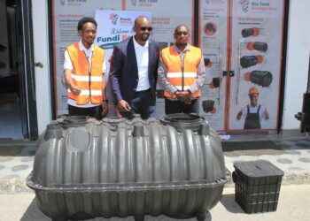 Edwin Kirugo (centre) with two plumbers at the Biotank Africa Fundi Forum event held in Kitengela town