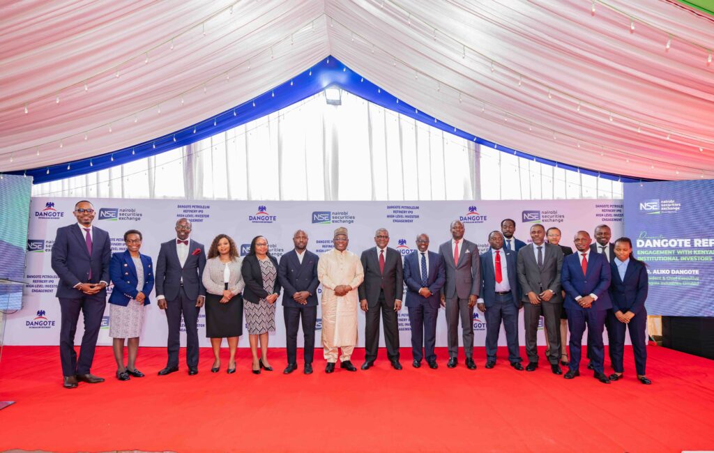 Transaction advisory team lead by Renassance Capital poses for a photo with Aliko Dangote