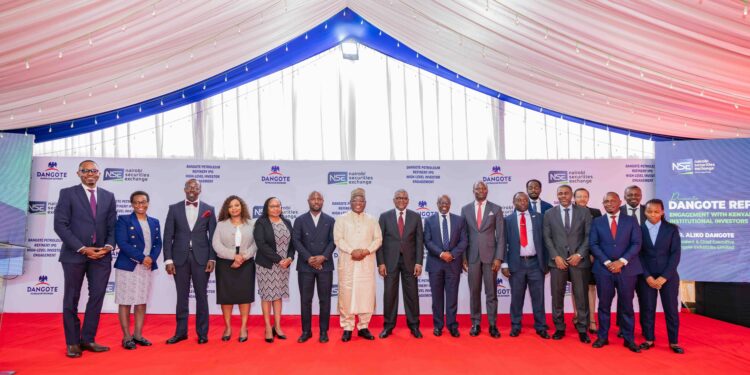 Transaction advisory team lead by Renassance Capital poses for a photo with Aliko Dangote
