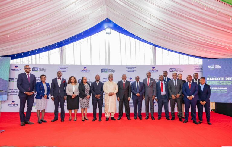 Transaction advisory team lead by Renassance Capital poses for a photo with Aliko Dangote
